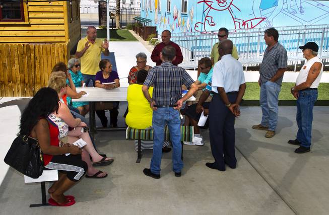 Attendees meet at the Learning Village during a planned gathering of concerned neighbors about the current noise and possibility of more downtown development on Thursday, May 15, 2014. Unfortunately no city representatives showed up stating meeting time had been changed to later in the day.