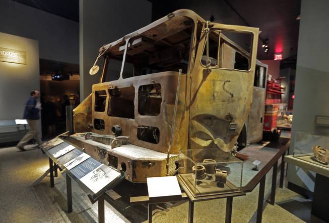 The remains of New York City Fire Dept. truck from Engine Company 21 are displayed at the National Sept. 11 Memorial Museum, Wednesday, May 14, 2014, in New York. The museum is a monument to how the Sept. 11 terror attacks shaped history, from its heart-wrenching artifacts to the underground space that houses them amid the remnants of the fallen twin towers' foundations. It also reflects the complexity of crafting a public understanding of the terrorist attacks and reconceiving ground zero.  (AP Photo)
