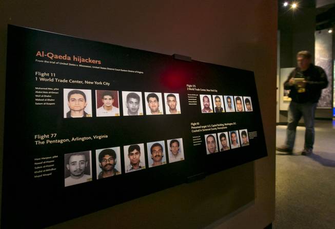 Portraits of the Al-Qaeda hijackers are displayed at the National Sept. 11 Memorial Museum, Wednesday, May 14, 2014, in New York. The museum is a monument to how the Sept. 11 terror attacks shaped history, from its heart-wrenching artifacts to the underground space that houses them amid the remnants of the fallen twin towers' foundations. It also reflects the complexity of crafting a public understanding of the terrorist attacks and reconceiving ground zero.  (AP Photo)