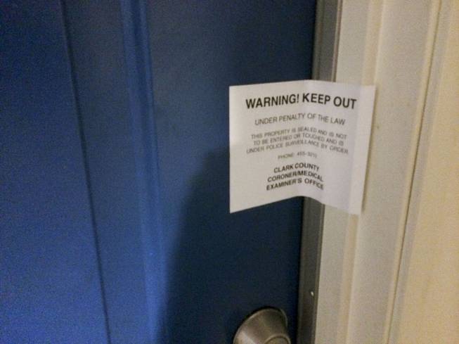 A warning sign from the coroner's office prohibits people from entering an apartment at the Buena Vista Springs complex Thursday, May 15, 2014.