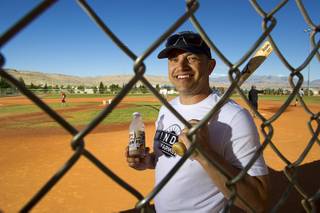 Sean McCrady, Las Vegas regional sales director for Winder Farms, poses before a casual Sunday baseball game at Red Ridge Park May 11, 2014.