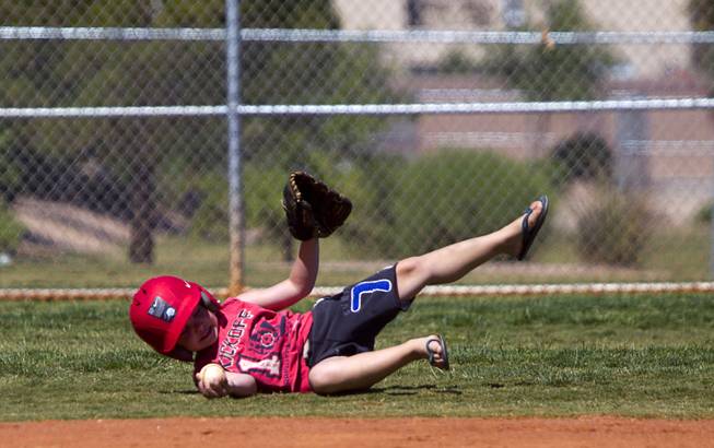 Sinjin McCrady, 5, fields a ball during a casual Sunday baseball game at Red Ridge Park May 11, 2014.