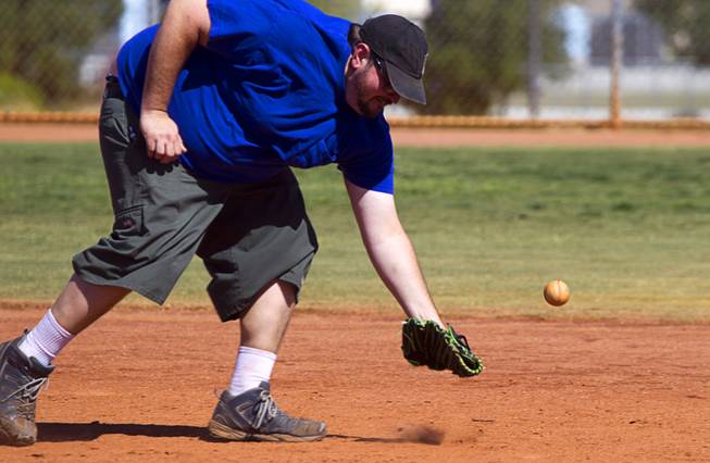 Vinny Greco of Winder Farms misses a grounder during a casual Sunday baseball game at Red Ridge Park May 11, 2014.