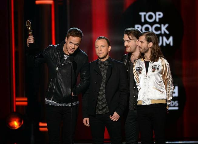 Las Vegas band Imagine Dragons accept their Top Rock Album award during the 2014 Billboard Music Awards at MGM Grand Garden Arena on Sunday, May 18, 2014.