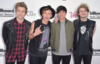 Luke Hemmings, Ashton Irwin, Calum Hood and Michael Clifford of the Australian boy band 5 Seconds of Summer arrive at the 2014 Billboard Music Awards at MGM Grand Garden Arena on Sunday, May 18, 2014, in Las Vegas.