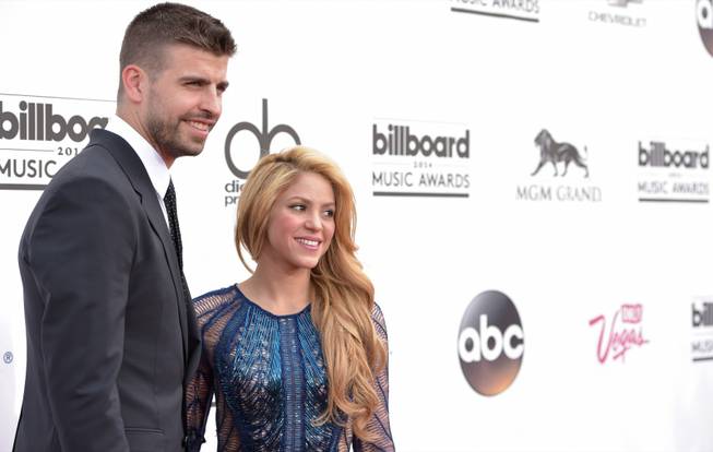 Gerard Pique and Shakira arrive at the 2014 Billboard Music Awards at MGM Grand Garden Arena on Sunday, May 18, 2014, in Las Vegas.