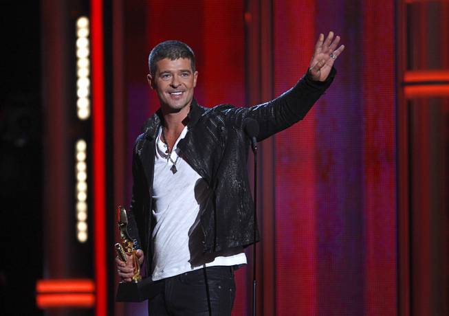 Robin Thicke accepts the Top R&B Song award for "Blurred Lines" during the 2014 Billboard Music Awards at MGM Grand Garden Arena on Sunday, May 18, 2014.