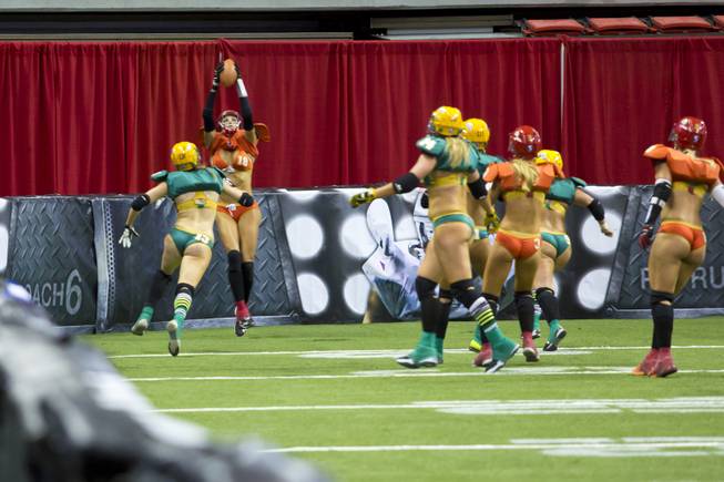 Cynthia Schmidt, of the Las Vegas SIN, scores a touchdown against Green Bay Chill, Thursday May 15, 2014. The SIN beat Green Bay 34 to 24 at Thomas & Mack Center, their first win of the Legends Football League season.