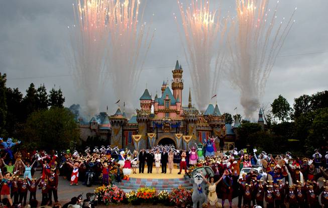 Disney executives, characters and guests stand in front of the refurbished castle during Disney's 50th Anniversary Global Celebration at Disneyland in Anaheim, Calif., on Thursday, May 5, 2005.