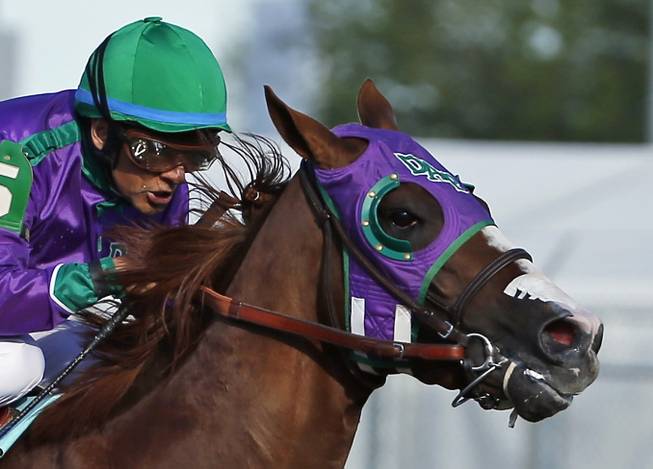 In this Saturday, May 3, 2014, photo, jockey Victor Espinoza rides California Chrome to win the 140th running of the Kentucky Derby at Churchill Downs in Louisville, Ky.