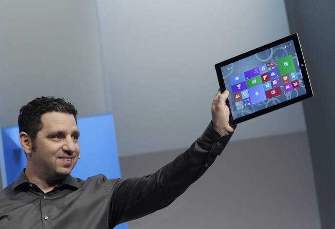 Panos Panay, Microsoft's vice president for surface computing, introduces the Surface Pro 3 tablet device at a media preview, Tuesday, May 20, 2014, in New York. The device will have a screen measuring 12 inches diagonally, up from 10.6 inches in previous models. Microsoft says it's also thinner and faster than before.