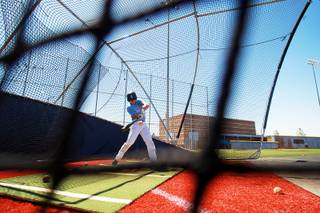 Centennial baseball player Hayden Grant takes batting practice Tuesday, May 20, 2014.