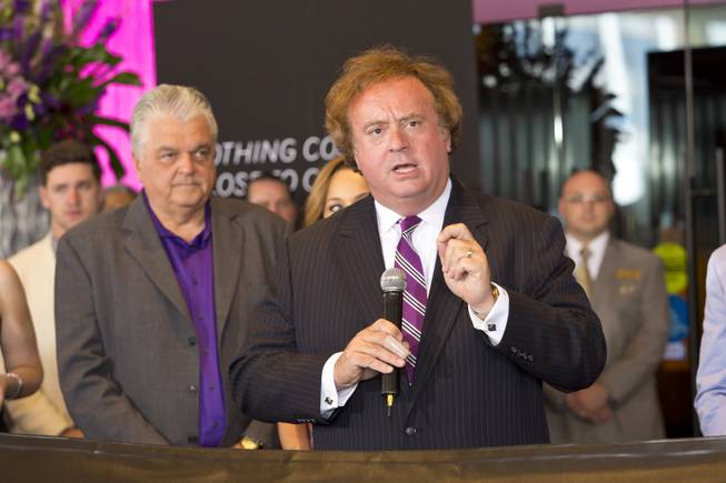 Clark Counry Commissioner Steve Sisolak looks on as Gary Loveman, ceo and president of Caesars Entertainment, says a few words during the ribbon-cutting ceremony at The Cromwell, Wednesday May 21, 2014. The Cromwell is the first stand-alone boutique hotel located on the Las Vegas Strip.
