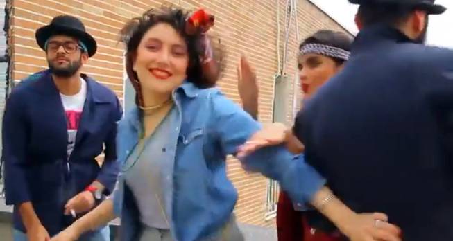 In this frame grab taken from video posted to YouTube, people dance to Pharrell Williams' hit song "Happy" on a rooftop in Tehran, Iran. Police in Iran have arrested six young people and shown them on state television for posting the video. While the song has sparked similar videos all over the world, in Iran some see the trend as promoting the spread of Western culture. And women are banned from dancing in public or appearing outside without the hijab in the Islamic Republic.
