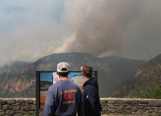 Coconino National Forest Battalion Chief Preston Mercer, left, and fire information officer Bill Morse, right, survey a fire burning in Oak Creek Canyon, Ariz., on Wednesday, May 21, 2014. 