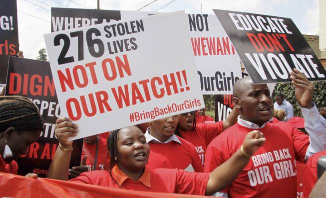 A coalition of Kenyan women's groups stage a protest in solidarity with their counterparts in Nigeria and demanding the release of the hundreds of schoolgirls abducted in Nigeria by the Muslim extremist group Boko Haram, in downtown Nairobi, Kenya Thursday, May 15, 2014.