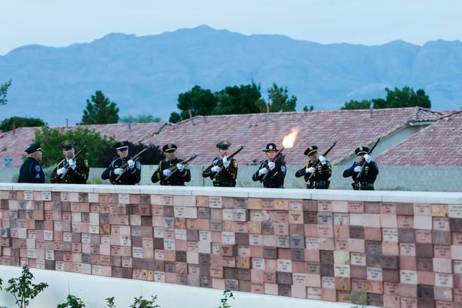 A 21-gun salute is performed in honor of Nevada fallen officers during the Southern Nevada Law Enforcement Memorial ceremony at Police Memorial Park in Las Vegas Thursday, May 22, 2014.