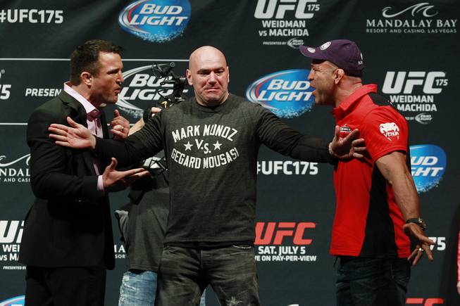 Dana White separates Chael Sonnen, left, and Wanderlei Silva during a news conference to promote UFC 175 Friday, May 23, 2014, at the MGM Grand Garden Arena. 