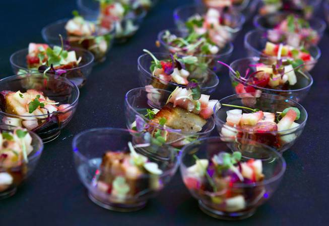 Delmonico serves an apple bacon with pickled watermelon rind and root beer syrup during the Epicurean Affair presented by the Nevada Restaurant Association at the Palazzo on Thursday, May 22, 2014.