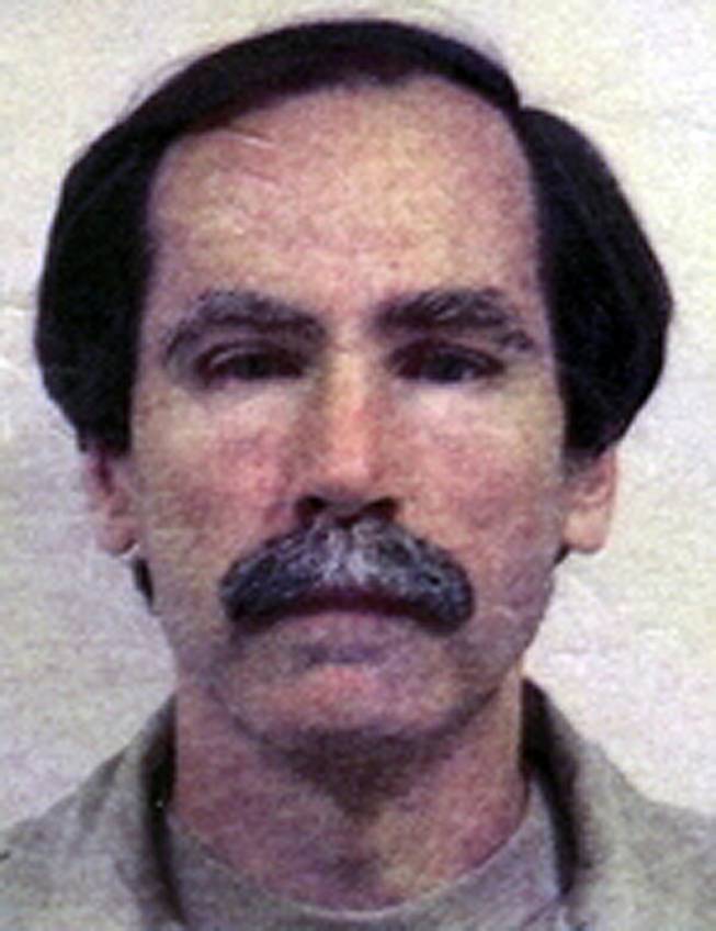 This undated file image provided by the Department of Justice shows convicted serial rapist Christopher Hubbart. 
