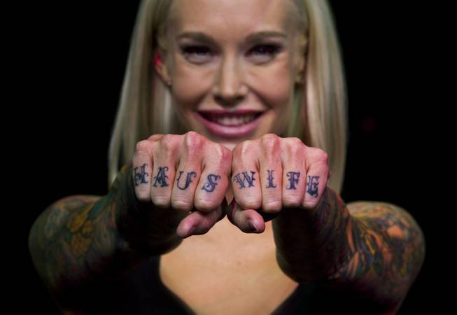 Sabina Kelley shows off her finger tattoos on the stage of  Pin Up as the understudy for Claire Sinclair at the Stratosphere Theater on Friday, May 23, 2014.