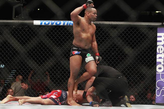 Daniel Cormier leaps up after defeating Dan Henderson during their fight at UFC 173 Saturday, May 24, 2014 at the MGM Grand Garden Arena. Cormier won with a rear naked choke in the third round.