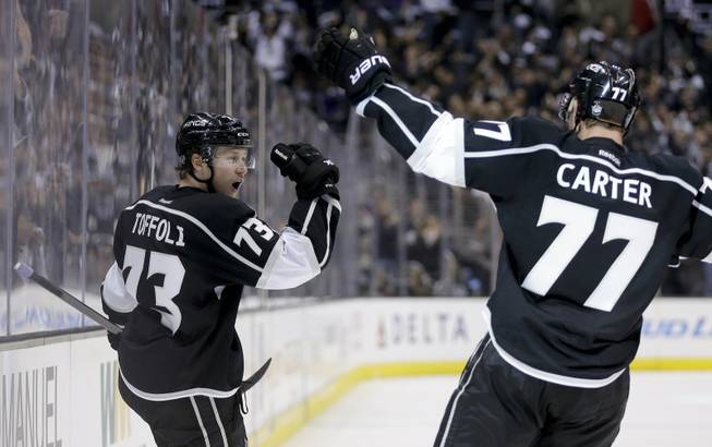 Los Angeles Kings center Tyler Toffoli, left, celebrates his goal with teammate Jeff Carter against the Chicago Blackhawks during the second period of Game 3 of the Western Conference finals of the NHL hockey Stanley Cup playoffs in Los Angeles on Saturday, May 24, 2014.