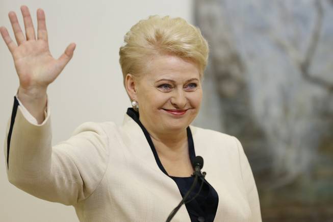 Lithuania's President Dalia Grybauskaite and presidential candidate celebrates winning a second term in office with his supporters in Vilnius, Lithuania on Sunday, May 26, 2014. 