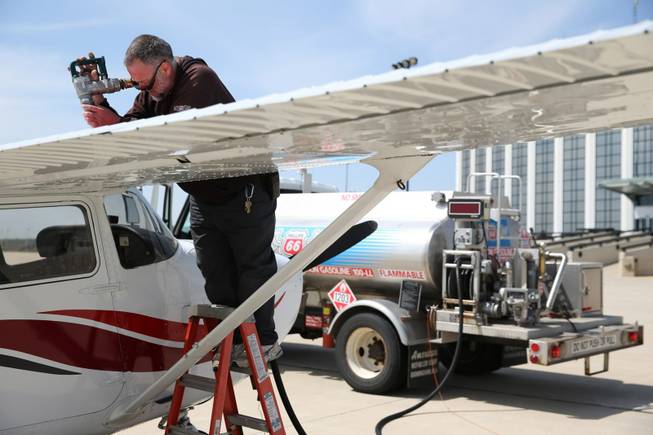 Mark Grisco fuels a small airplane at DuPage Airport in West Chicago, Ill., on May 9, 2014. Though not used in cars in the U.S., fuel containing lead is still used in some small, private aircraft.