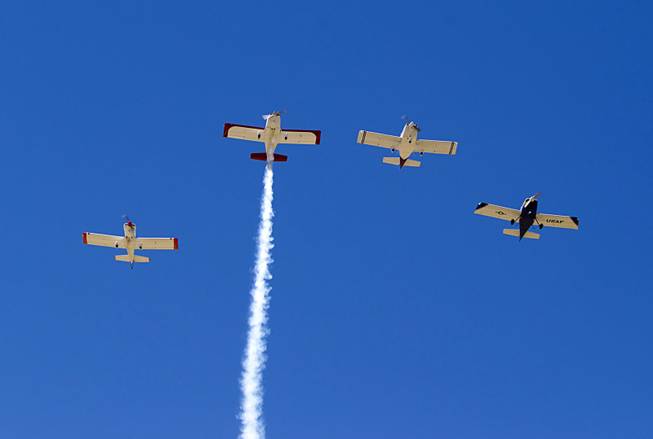 The Boulder City Veterans Pilot Group flies in a "Missing Man Formation" during a Memorial Day ceremony at the Southern Nevada Veterans Memorial Cemetery in Boulder City Monday, May 26, 2014.