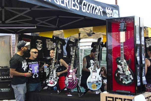 A vendor sells custom designed guitars at the Punk Rock Bowling & Music Festival Sunday, May 25, 2014.