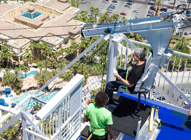 Bruce Buffer (strapped in seat) kicked off the opening of Rio's VooDoo Zip Line Sunday, May 25, 2014.  Courtesy of Rio Photo credit to Erik Kabik.