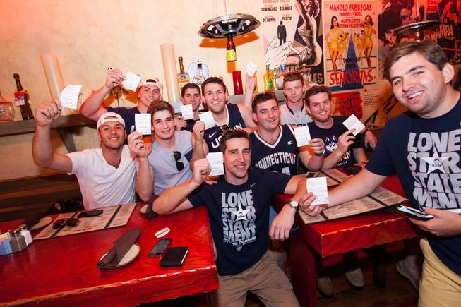 On Saturday, May 24, 2014, graduates of the University of Connecticut stopped by Hard Rock Hotel Las Vegas to pick up their winnings: a total of $60,000. First row, at Pink Taco in the Hard Rock: Marc Demattie and Andrew Zielinski. Second row: Ferid Frank Feratovic, Paul Delvecchio, Dave Faenza and John Mitkevicius. Third row: Tom Andreoli, Dan Stewart, Harrison Fuchs and Michael Price.