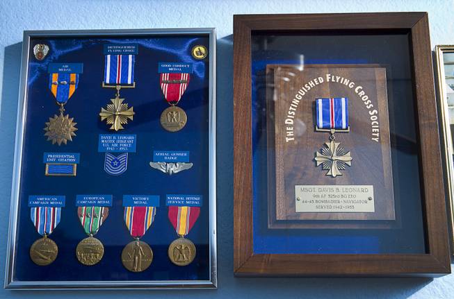 Medals, including the Distinguished Flying Cross, right, are displayed in the home of World War II veteran Davis B. Leonard in Henderson Wednesday, May 28, 2014. Leonard and Gaetano "Guy" Benza, another local World War II veteran, will receive the French Legion d'Honneur award on Friday. The award is the highest honor France bestows on its citizens and foreign nationals.