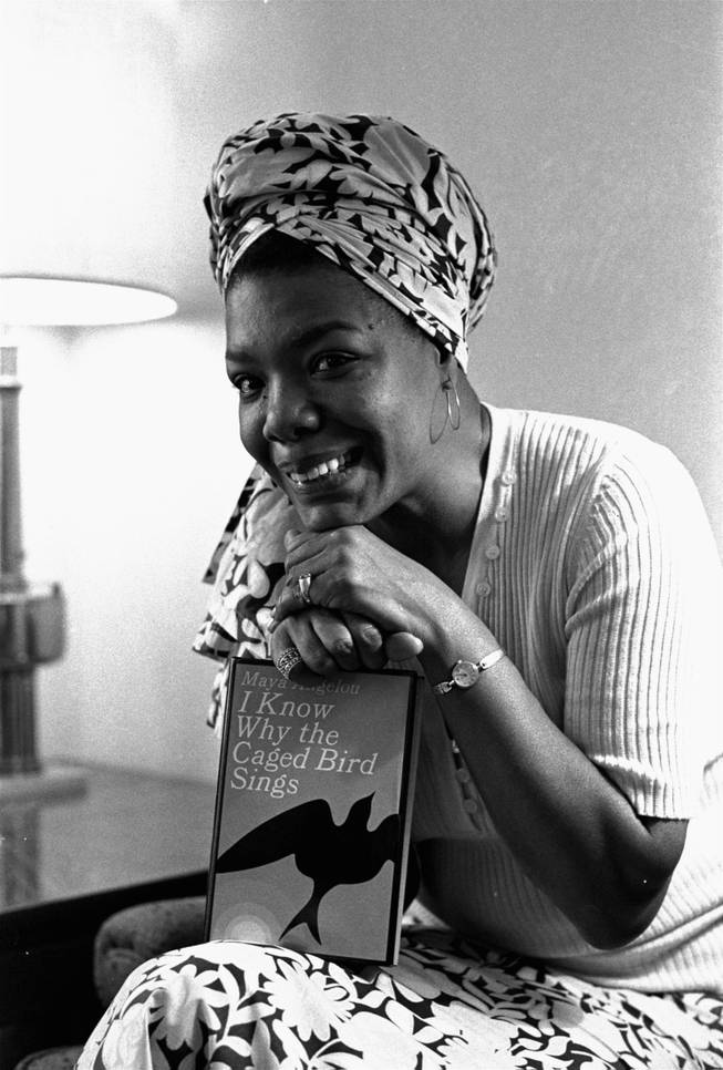 In this Nov. 3, 1971 file photo, Maya Angelou poses with a copy of her book, "I Know Why the Caged Bird Sings," in Los Angeles. Angelou, a Renaissance woman and cultural pioneer, has died, Wake Forest University said in a statement Wednesday, May 28, 2014. She was 86. 