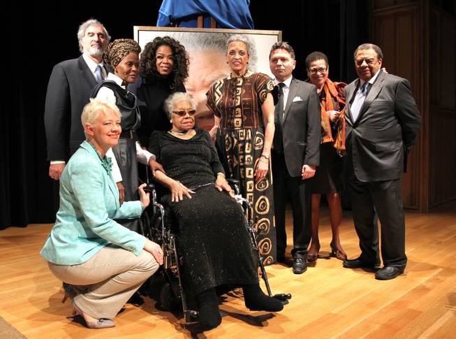 Left to right, Kim Sajet, Richard Kurin, Cicely Tyson, Oprah Winfrey, Maya Angelou, Johnnetta Cole, Ross Rossin, Eleanor Holmes Norton and Amb. Andrew Young pose for a photo at Maya Angelou's portrait unveiling at the Smithsonian's National Portrait Gallery on Saturday, April 5, 2014 in Washington, DC. 