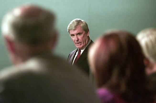 Governor Kenny Guinn addresses representatives from the Department of Energy during the DoE's public hearing on the proposed Yucca Mountain Repository Sept. 5, 2001.