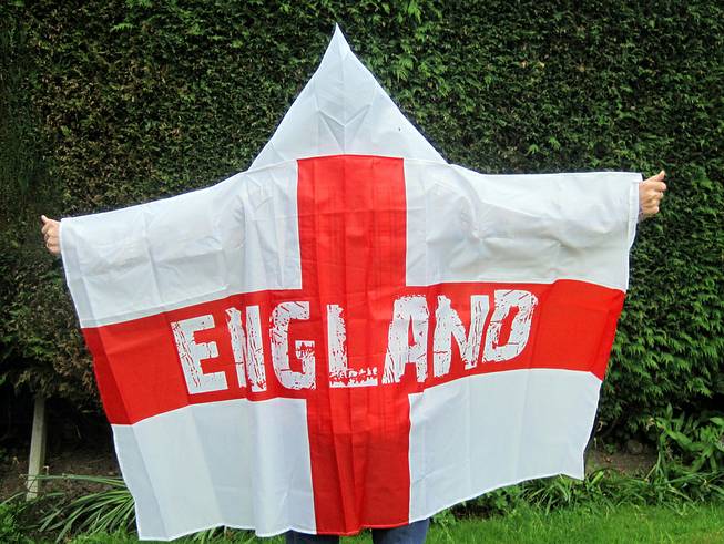 A man models a wearable England flag, made by Asda, in London, Friday, May 30, 2014. British supermarket chain Asda has been criticized for launching a wearable England flag ahead of the World Cup that some customers say resembles an outfit worn by U.S. far-right organization the Ku Klux Klan.