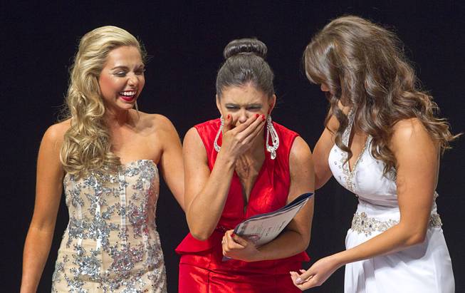 Ellie Smith, center, of Henderson reacts as she is named 2014 Miss Nevada at the Miss Nevada and Miss Nevada Outstanding Teen Pageant at the Las Vegas Academy Theater Sunday, June 1, 2014. Her sister Amy Smith was crowned 2014 Miss Nevada Outstanding Teen.