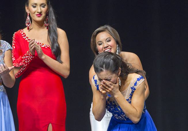Amy Smith of Henderson reacts as she is named 2014 Nevada Outstanding Teen at the Miss Nevada and Miss Nevada Outstanding Teen Pageant at the Las Vegas Academy Theater Sunday, June 1, 2014. Amy's sister Ellie Smith later was crowned 2014 Miss Nevada.