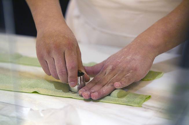 Pasta chef Michael Palomino makes spring pea tortellini during the VIP grand opening of Giada, the first Giada De Laurentiis restaurant, on Monday, June 2, 2014, in the Cromwell. The restaurant opens to the public Tuesday.