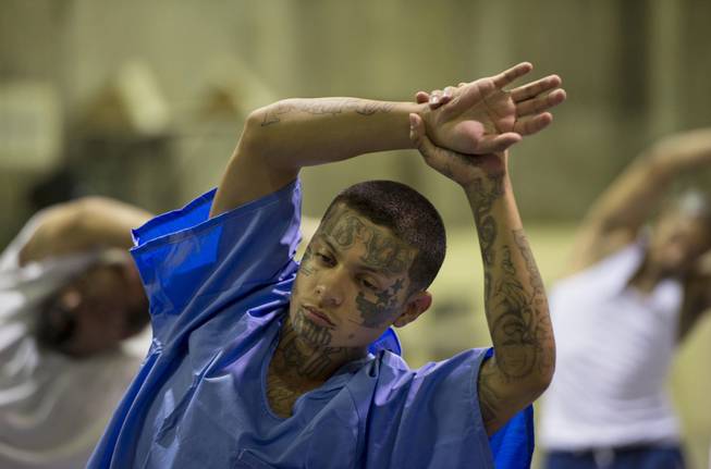 Sergio Arzate, an inmate at California State Prison in Sacramento, Calif., practices yoga in a class taught at the prison though the Yoga Seed Collective outreach program on April 20, 2014.