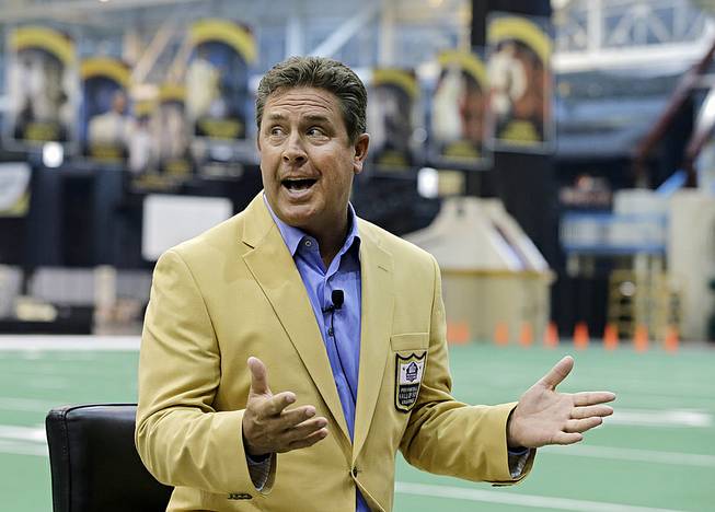 Miami Dolphins Hall of Fame quarterback Dan Marino speaks to reporters about the Pro Football Hall of Fame fanjets at the I-X Center in Cleveland Tuesday, April 29, 2014. 