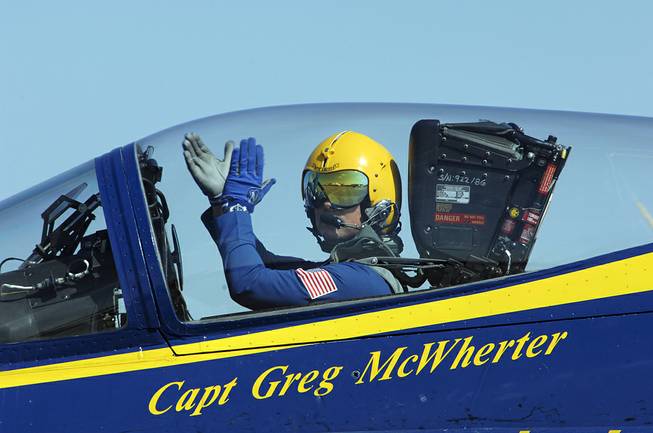 Capt. Greg McWherter, commanding officer and flight leader of the U.S. Navy flight demonstration squadron, the Blue Angels, responds to the crowd at the Guardians of Freedom Air Show in Lincoln, Neb., Sept. 10, 2011.