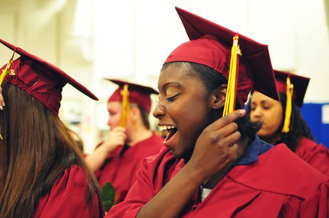 Simone Taylor, 25, turns her tassel as she celebrates graduating from the Clark County School District's adult education program at the Florence McClure Women's Correctional Center on Tuesday, June 3, 2014. More than 70 female inmates at Nevada's sole women's prison earned their high school diplomas, GEDs and vocational certificates this year.