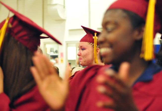 Anna Curtis, 26, becomes teary-eyed as she celebrates graduating from the Clark County School District's adult education program at the Florence McClure Correctional Center on Tuesday, June 3, 2014. The Clark County School District recognized more than 70 inmates who earned high school diplomas, GEDs and vocational certificates this year.