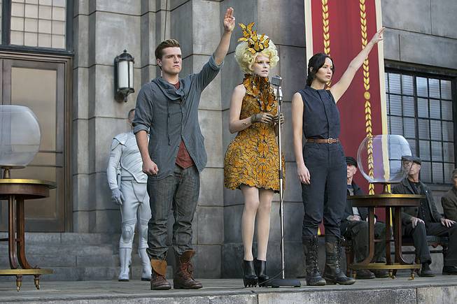 This image released by Lionsgate shows, from left, Josh Hutcherson as Peeta Mellark, Elizabeth Banks as Effie Trinket and Jennifer Lawrence as Katniss Everdeen in a scene from the film, "The Hunger Games: Catching Fire." 