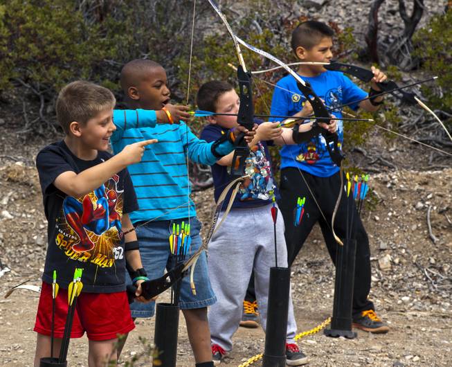 Campers laugh as an archery lesson continues during Camp Vegas at Pitosi Pines sponsored by the Nevada Diabetes Association Tuesday, April 15, 2014.