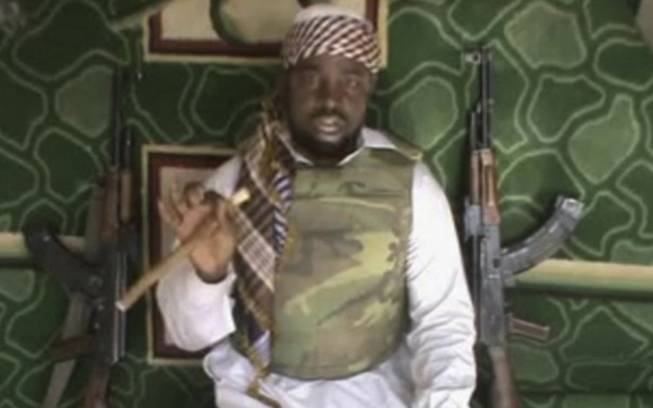 This file image made available from Wednesday, Jan. 10, 2012, taken from video posted by Boko Haram sympathizers shows Imam Abubakar Shekau, the leader of the radical Islamist sect. Boko Haram militants dressed as soldiers slaughtered at least 200 civilians in three villages in northeastern Nigeria and the military failed to intervene, even though it was warned that an attack was imminent, witnesses said on Thursday, June 5, 2014.
