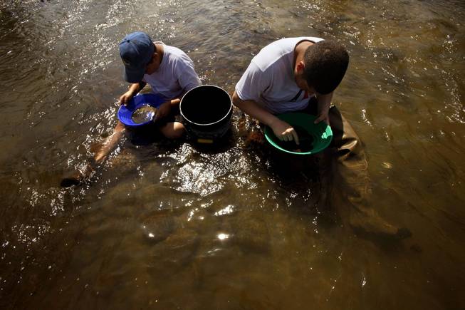 Drought conditions have lowered water levels in California and given prospectors like Brock O'Dell, 12, left, and his cousin, Anthony O'Dell, the chance to pan for gold in areas previous not accessible.